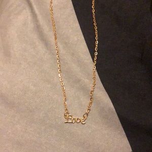 gold “love” necklace